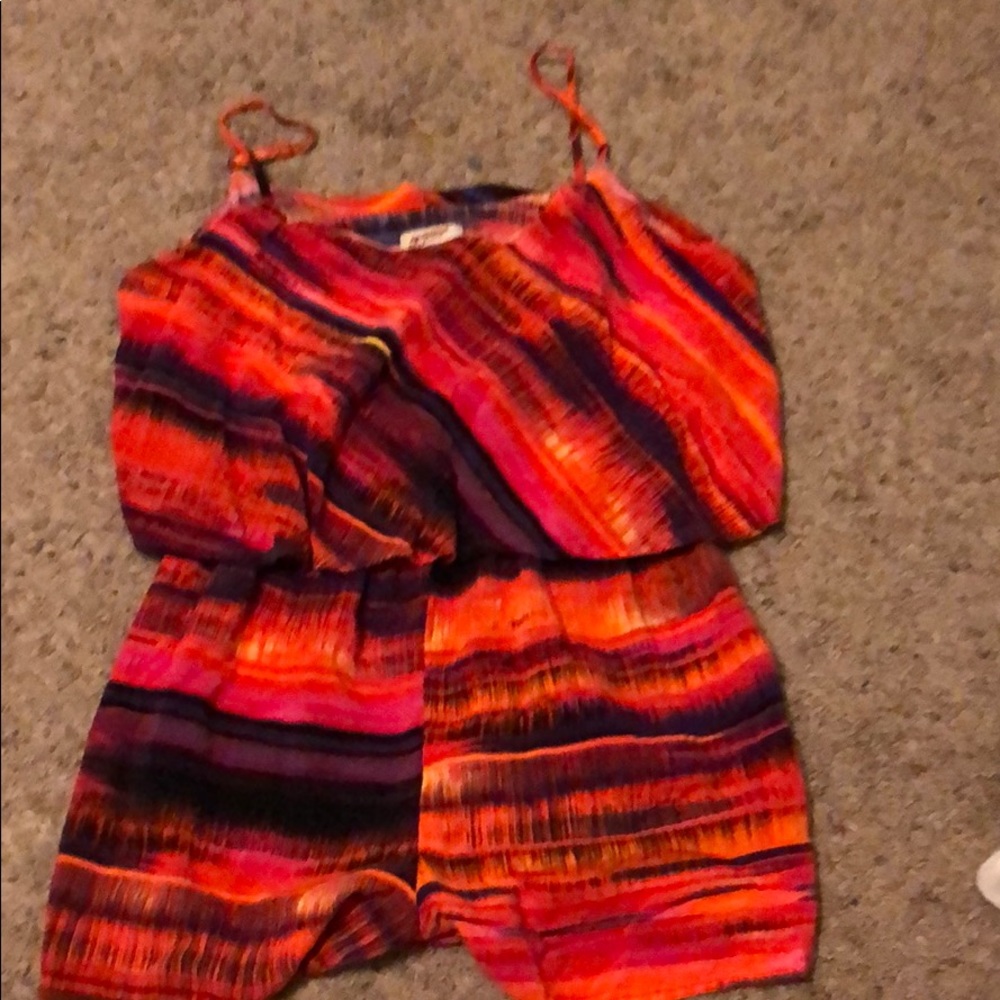 A medium size romper with multiple colors on it